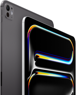 ตัวเครื่องภายนอกด้านหลังของ iPad Pro สีดำสเปซแบล็ค แสดงปุ่มปรับระดับเสียงและระบบกล้องระดับโปร, ตัวเครื่องภายนอกด้านหน้าของ iPad Pro สีเงิน แสดงมุมมนและขอบจอภาพสีดำ, จอภาพแสดงพื้นหลังสีดำที่มีลายเส้นนามธรรมหลากสีสัน